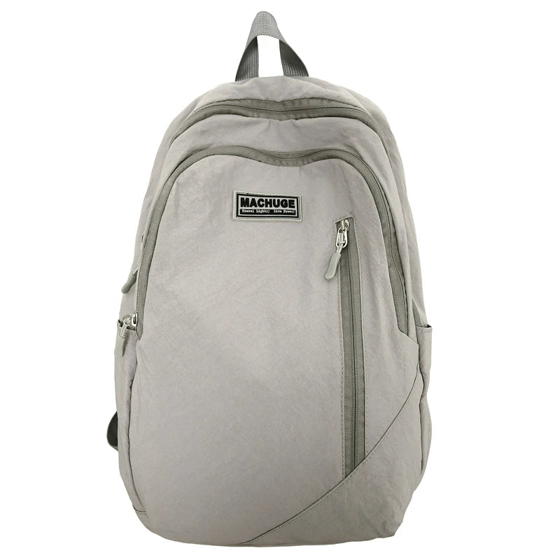 Backpack simple and large-capacity men's and women's travel backpacks leisure summer students waterproof spine backpack.